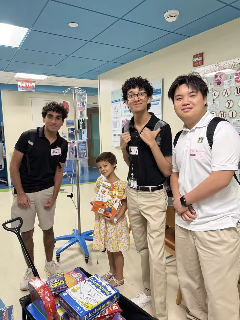 Students gathering donated board games at a community drive